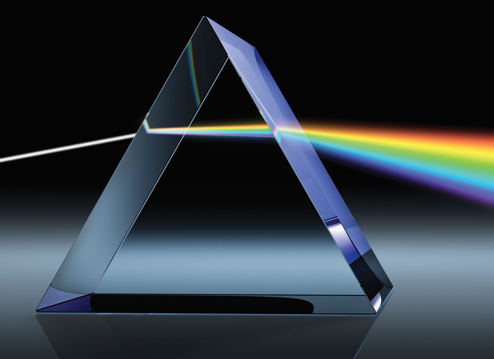 A prism scattering white light (Britannica)