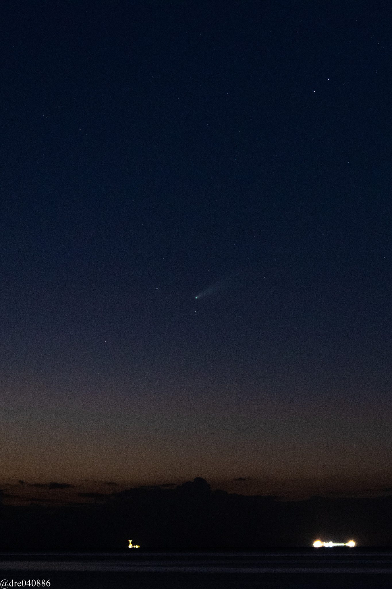 NEOWISE spotted from La Romain, San Fernando, Trinidad by Andre Goberdhan seen in the center of the image.