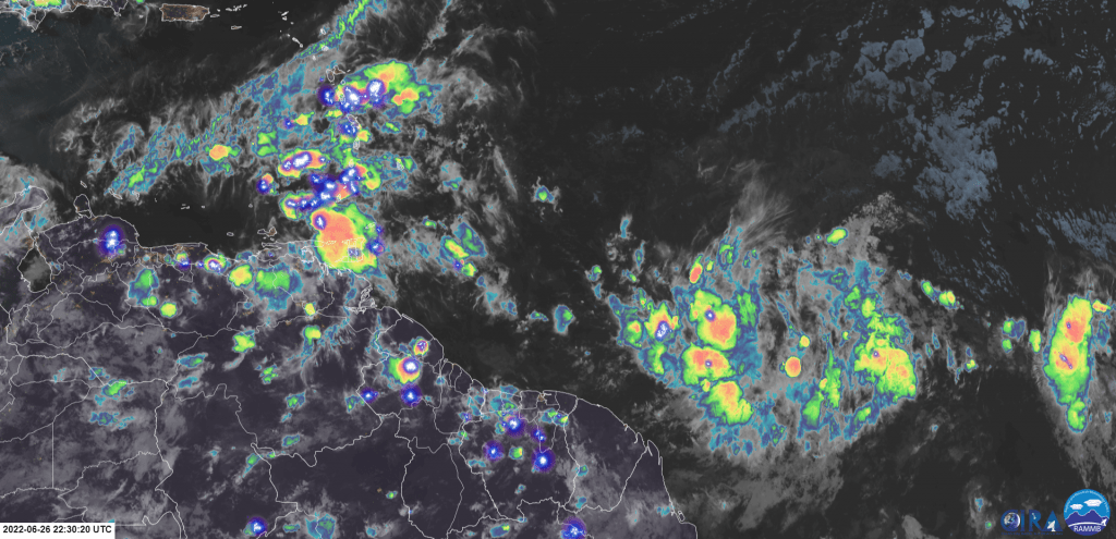 GOES-16 Infrared Satellite Imagery of Tropical Wave 12/Invest 94L, with scattered convection associated with the disturbance in the central Tropical Atlantic Ocean. Showers and thunderstorms associated with Tropical wave 11 are also affecting the Lesser Antilles Sunday night.