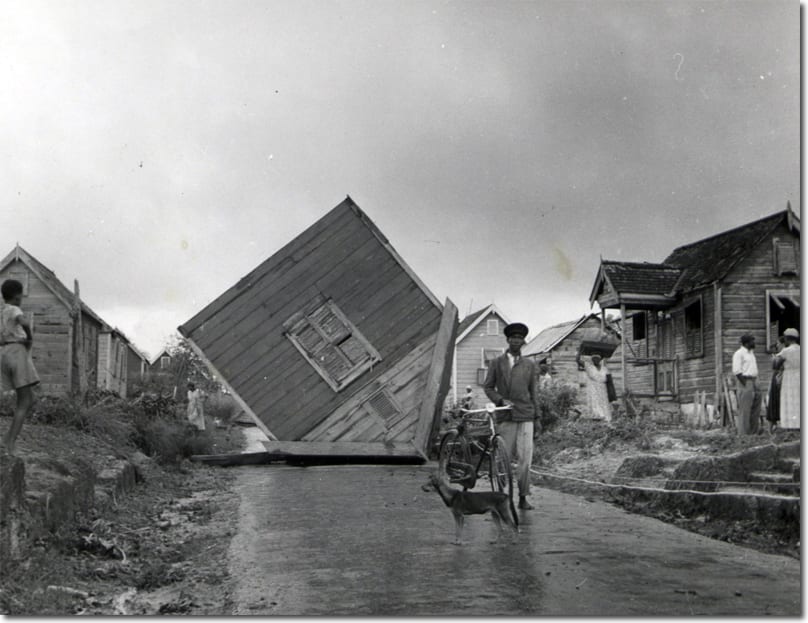 Damage in Barbados following a direct hit from Category 2 Hurricane Janet. A tropical storm warning was issued for Tobago when this cyclone traversed the region in 1955 and a storm shelter collapsed in Port of Spain, killing ten. Image courtesy of The National Archives.