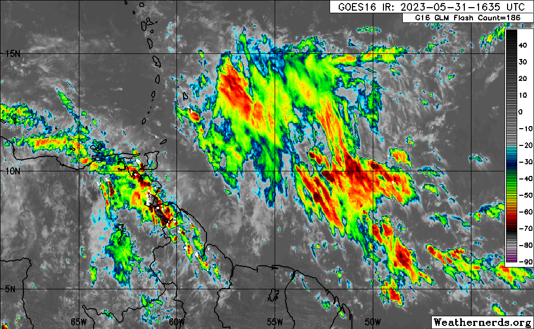 The axis of Tropical Wave 06 along 58/59W on Wednesday, May 31st, 2023, with showers and thunderstorms affecting parts of Trinidad and Tobago, with the bulk of cloudiness, showers, and thunderstorms still east of the area (Weathernerds.org)