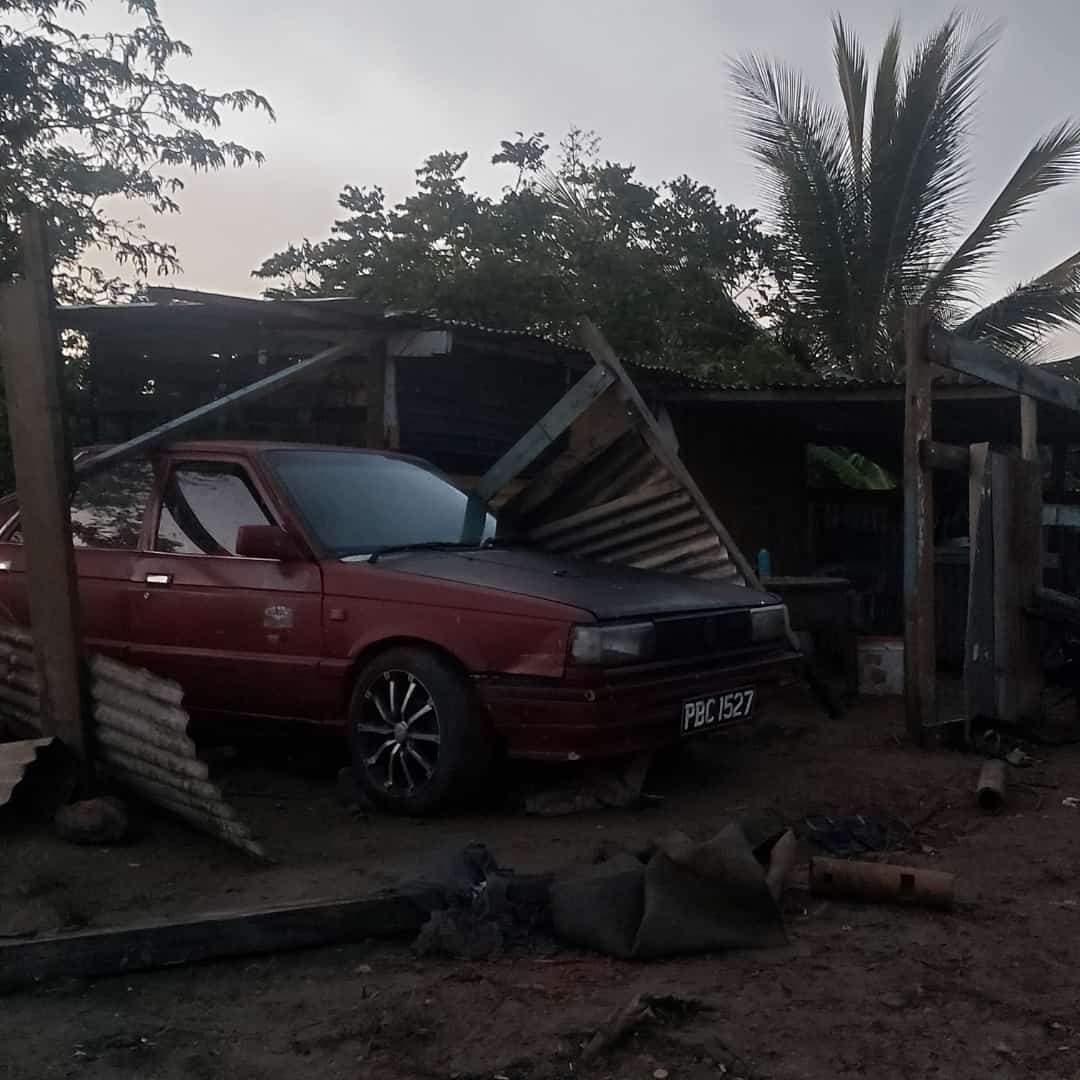Sheets of galvanize on a vehicle in Los Iros, South Trinidad, due to a tornado on August 16th, 2021.